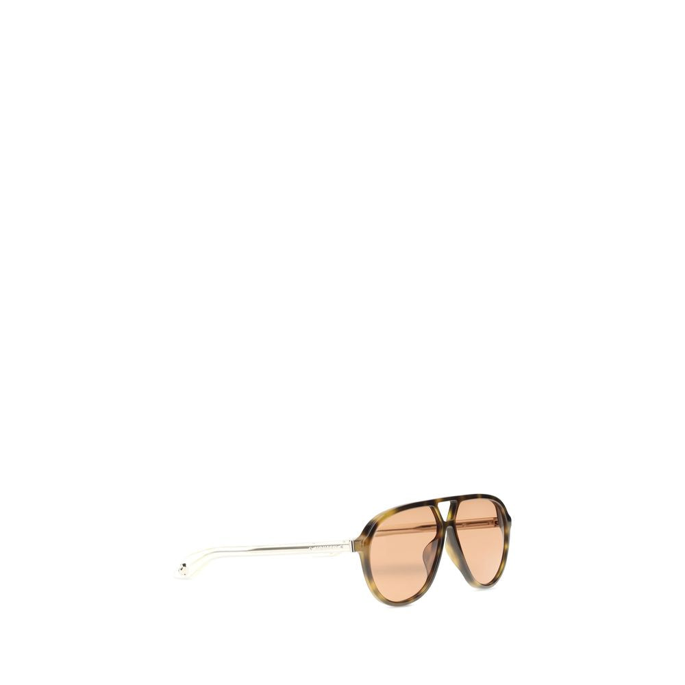 Indulge in the bold elegance of Alexander McQueen's Brown Acetate Sunglasses, crafted in Italy with a contemporary navigator shape, perfect for discerning tastes.