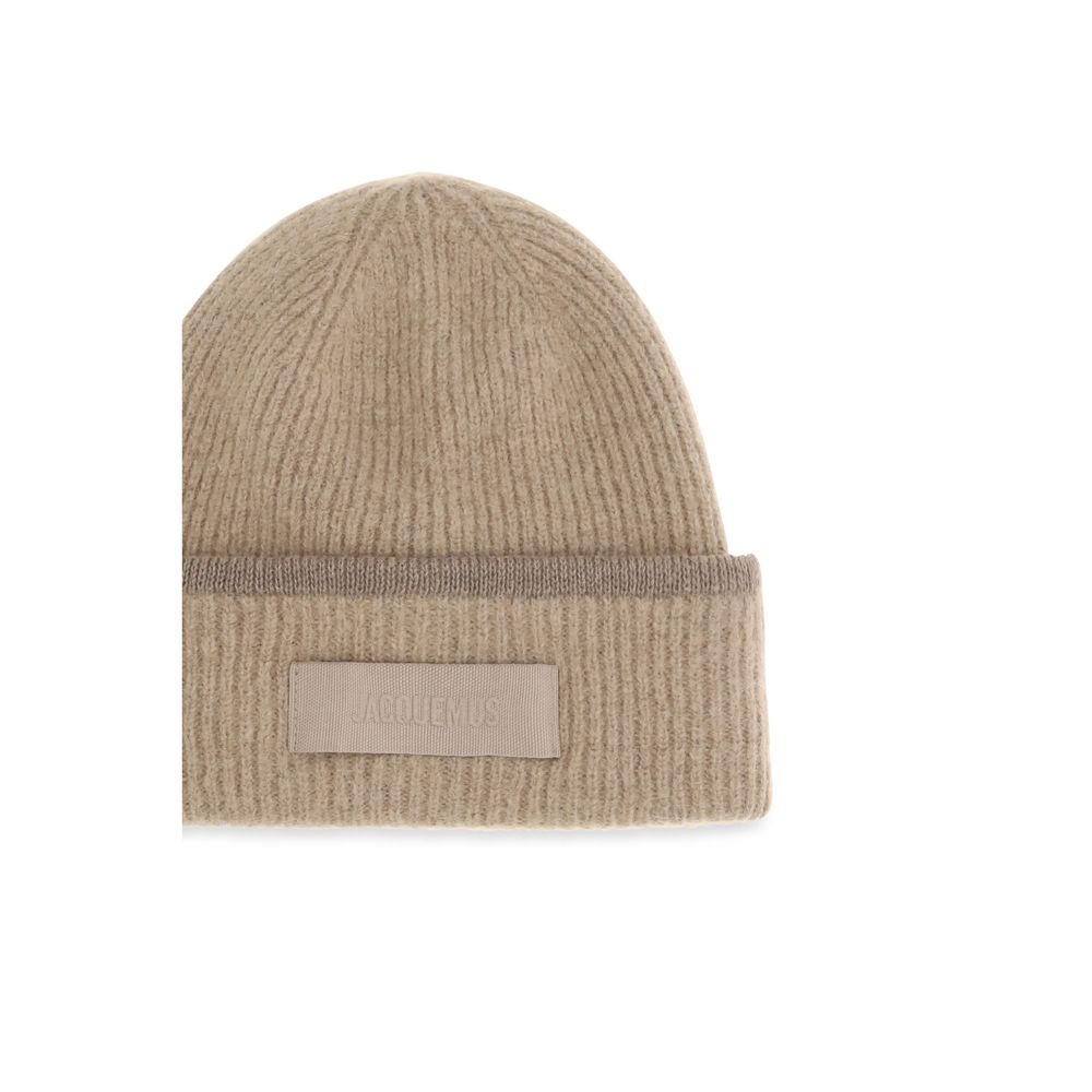 Indulge in the exquisite Jacquemus Beige Alpaca Vicugna Pacos Beanie, a harmonious blend of luxury and comfort, embodying timeless elegance for discerning tastes.