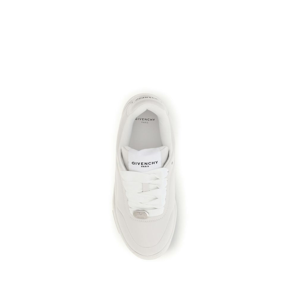 Indulge in the opulence of Givenchy's White Lamb Ovis Aries Low Top Sneakers, where exquisite lambskin meets effortless style, embodying luxury for the discerning individual.
