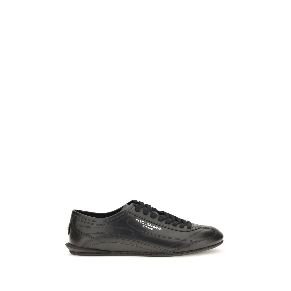 Experience the allure of Dolce & Gabbana's Black Calf Leather Bos Taurus Low Top Sneakers, a testament to Italian craftsmanship and refined luxury for the discerning individual.