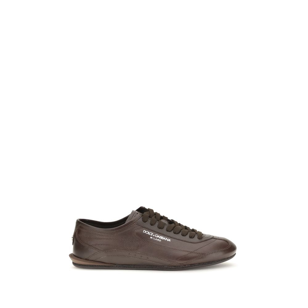 Indulge in the exquisite craftsmanship of Dolce & Gabbana's Brown Calf Leather Bos Taurus Low Top Sneakers, where refined elegance meets luxurious comfort for the discerning connoisseur.