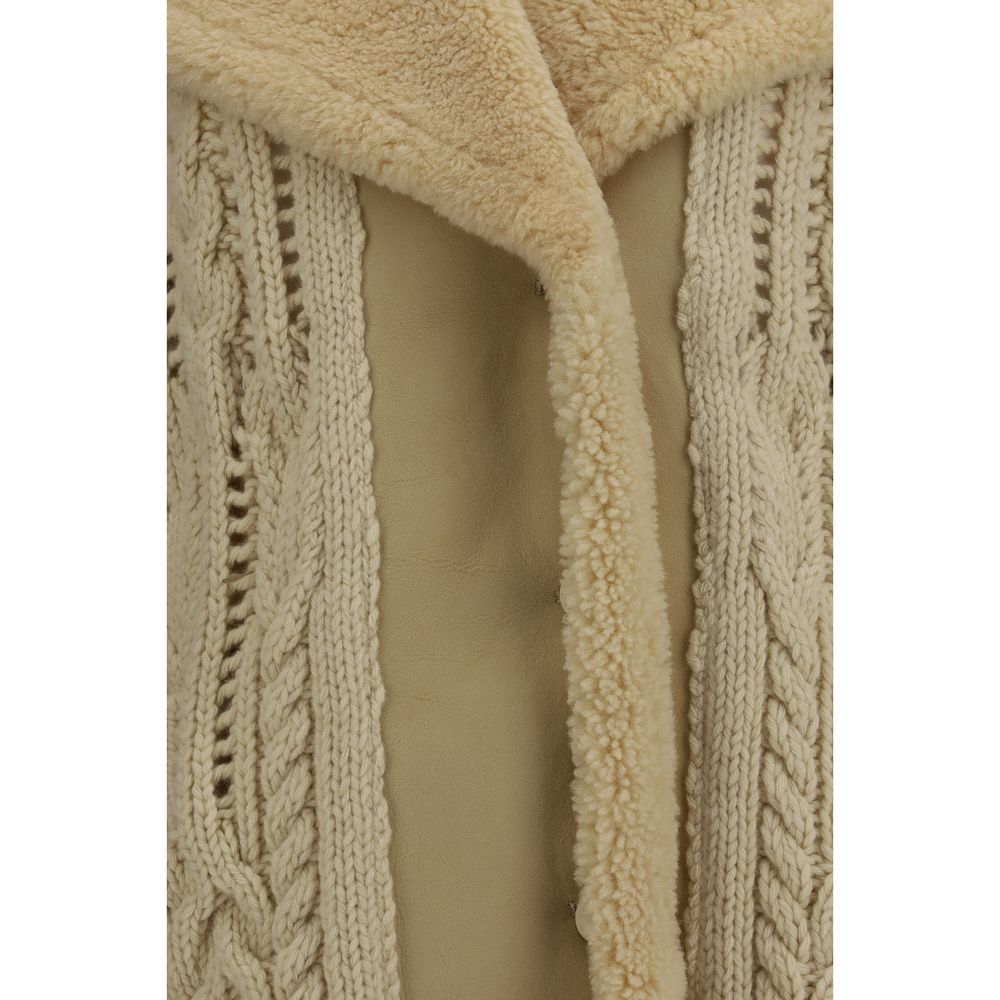Indulge in the luxurious Ermanno Scervino Beige Wool Oves Aries Sweatshirt, crafted from the finest virgin wool, embodying refined elegance and timeless sophistication.