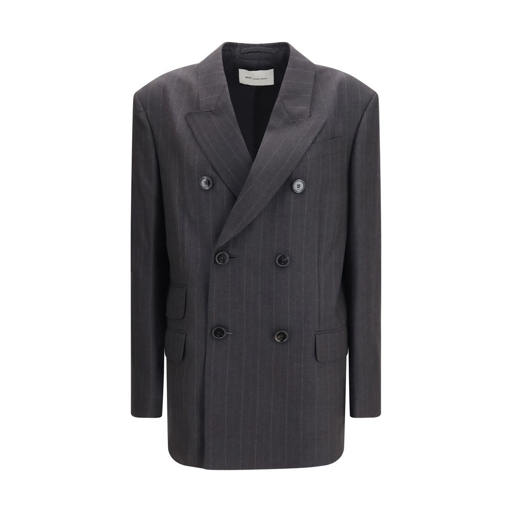Discover the AMI Paris Gray Wool Oves Aries Blazer, a masterpiece of tailored elegance, crafted from luxurious wool with exquisite detailing for the discerning individual.