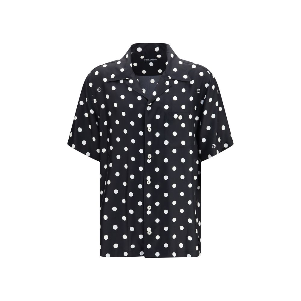 Elevate your wardrobe with the Dolce & Gabbana Black Silk Shortsleeve Shirt, a masterpiece of artisanal craftsmanship and vibrant design, perfect for the discerning individual.
