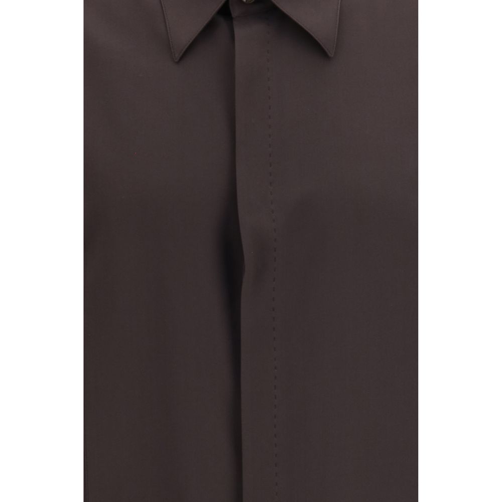 Indulge in the elegance of the Dolce & Gabbana Brown Silk Shirt, a masterpiece of Italian craftsmanship that embodies refined luxury and timeless sophistication.