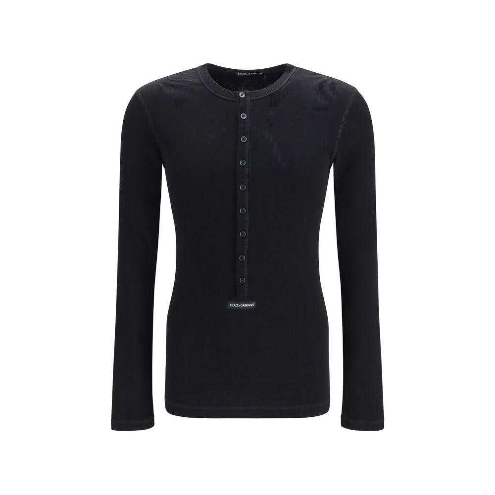 Indulge in the exquisite craftsmanship of the Dolce & Gabbana Black Cotton Long Sleeve T-Shirt, a timeless piece that embodies luxury and sophistication for the discerning individual.