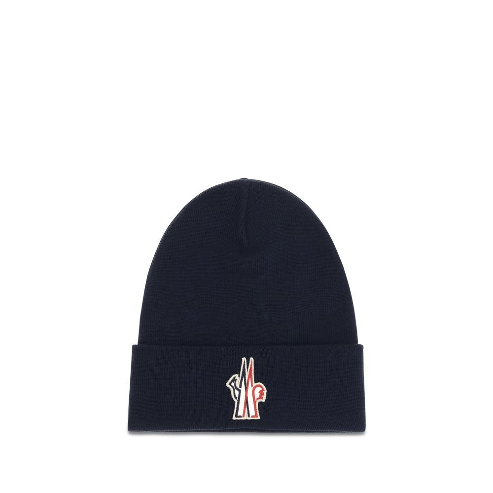 Indulge in the Moncler Grenoble Blue Wool Oves Aries Beanie, a masterpiece of soft virgin wool and rib-knit elegance, perfect for elevating your cold-weather style.