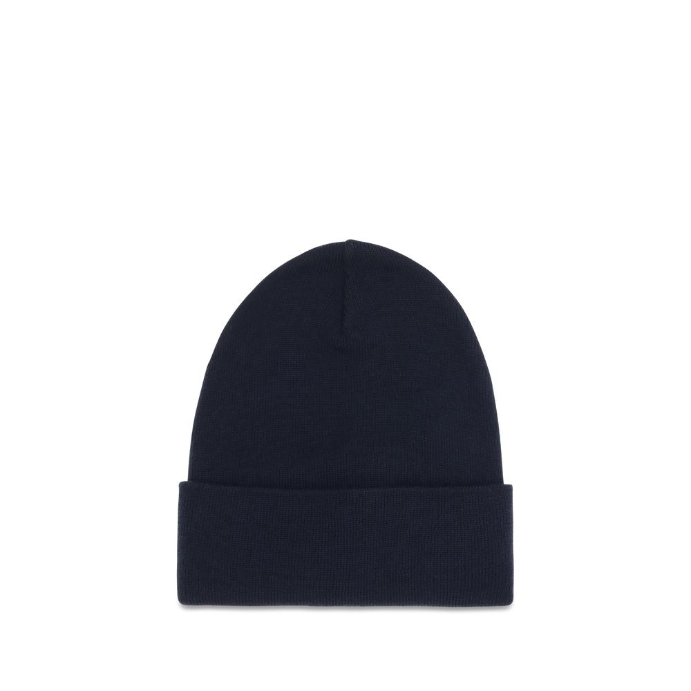 Indulge in the Moncler Grenoble Blue Wool Oves Aries Beanie, a luxurious blend of soft virgin wool and exquisite craftsmanship, perfect for elevating your cold-weather style.