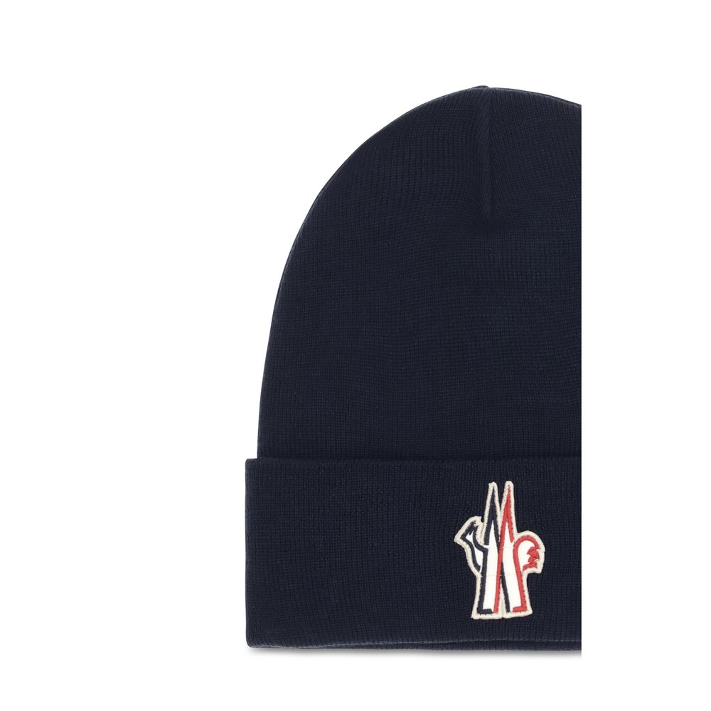 Indulge in the Moncler Grenoble Blue Wool Oves Aries Beanie, a masterpiece of soft virgin wool and exquisite rib-knit design, perfect for elevating your cold-weather style.