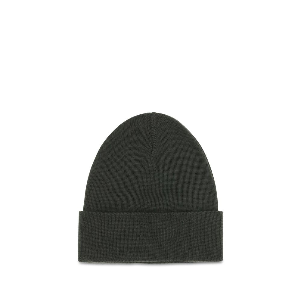 Indulge in the Moncler Grenoble Bicolor Wool Oves Aries Beanie, a masterpiece of soft virgin wool, offering warmth and elegance for the discerning individual.