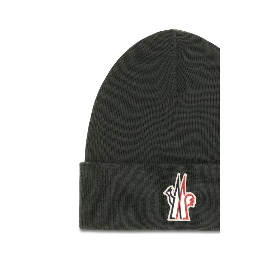 Indulge in the Moncler Grenoble Bicolor Wool Oves Aries Beanie, a masterpiece of soft virgin wool, blending warmth with refined elegance for the discerning individual.
