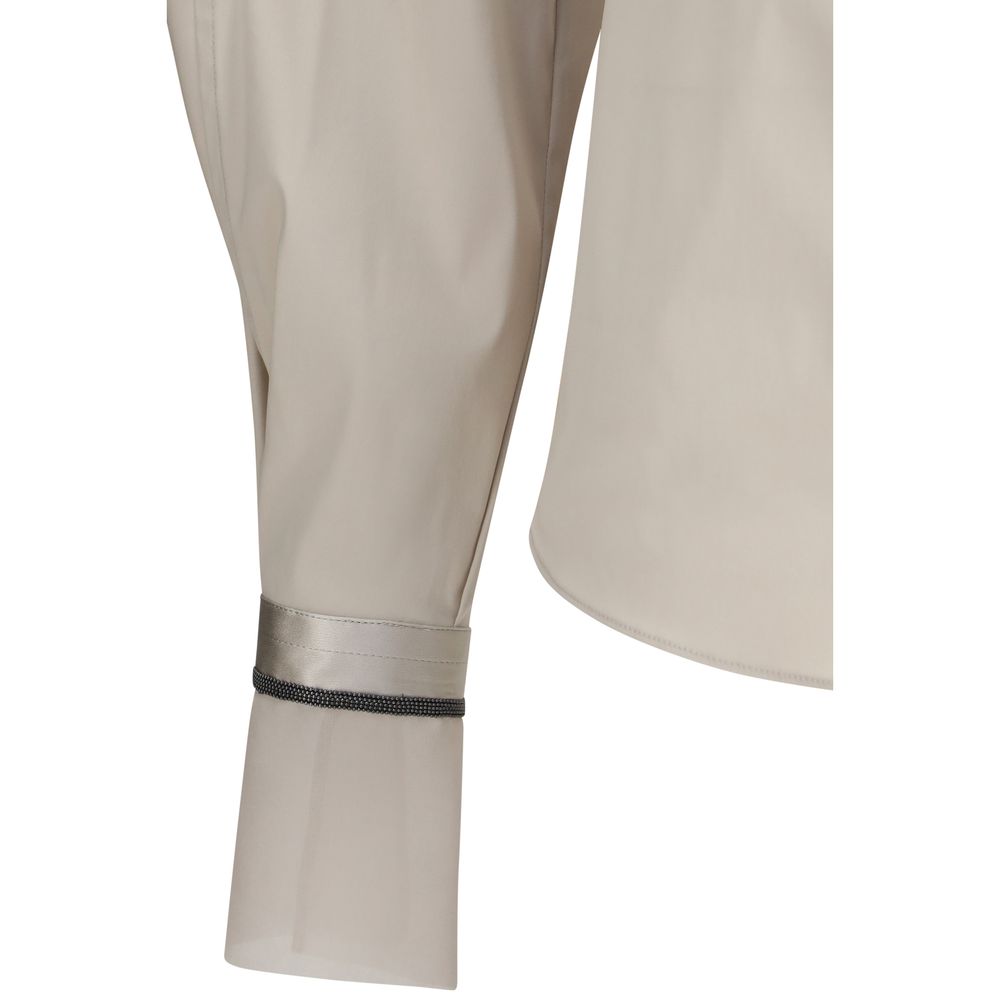 Discover the Brunello Cucinelli Beige Cotton Shirt, a masterpiece of stretch cotton poplin with silk cuffs, embodying elegance and sophistication for the discerning individual.