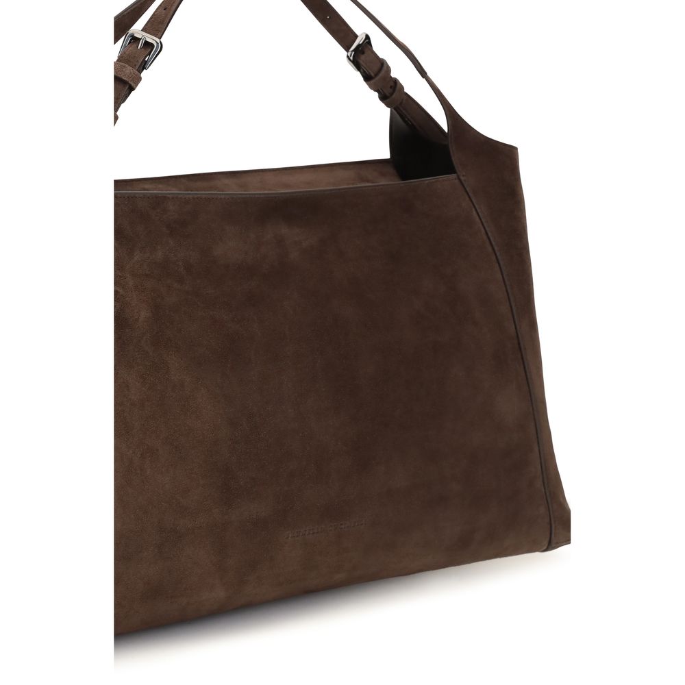 Indulge in the Brunello Cucinelli Brown Suede Leather Handbag, a masterpiece of exquisite craftsmanship and luxurious design, perfect for elevating any ensemble.