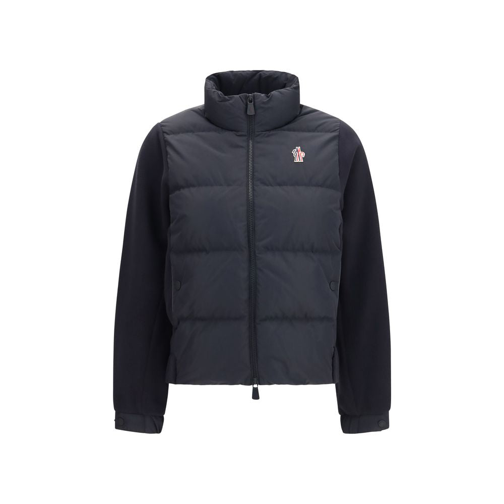 Discover the Moncler Grenoble Black Polyester Full-Length Jacket, a masterpiece of Polartec® insulation and exquisite craftsmanship, perfect for winter elegance and adventure.