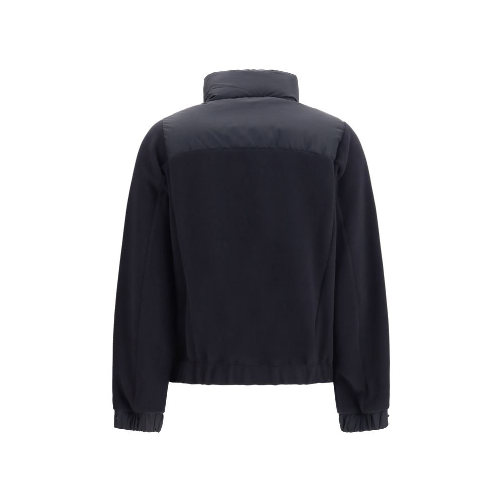 Indulge in the Moncler Grenoble Black Polyester Full-Length Jacket, a masterpiece of Polartec insulation and exquisite craftsmanship, perfect for elevating winter elegance.