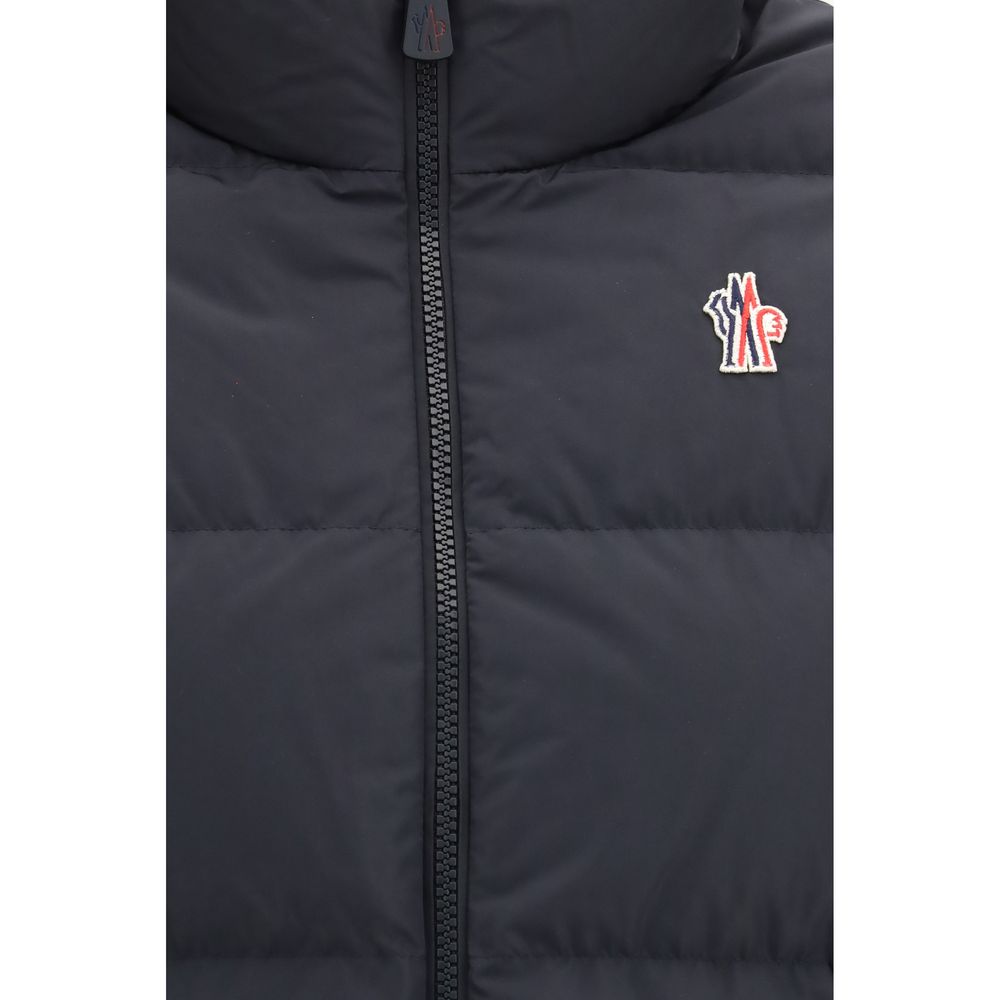 Experience the epitome of elegance with the Moncler Grenoble Black Polyester Full-Length Jacket, crafted from luxurious Polartec® insulation for unparalleled warmth and style.
