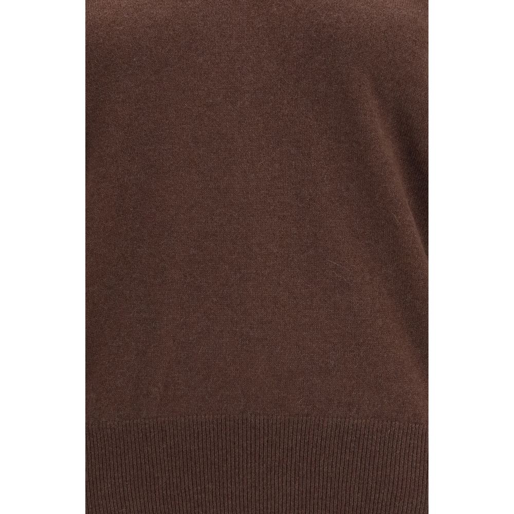 Indulge in the exquisite Brunello Cucinelli Brown Cashmere Sweater, a timeless masterpiece of pure cashmere that elevates your wardrobe with unparalleled luxury and sophistication.
