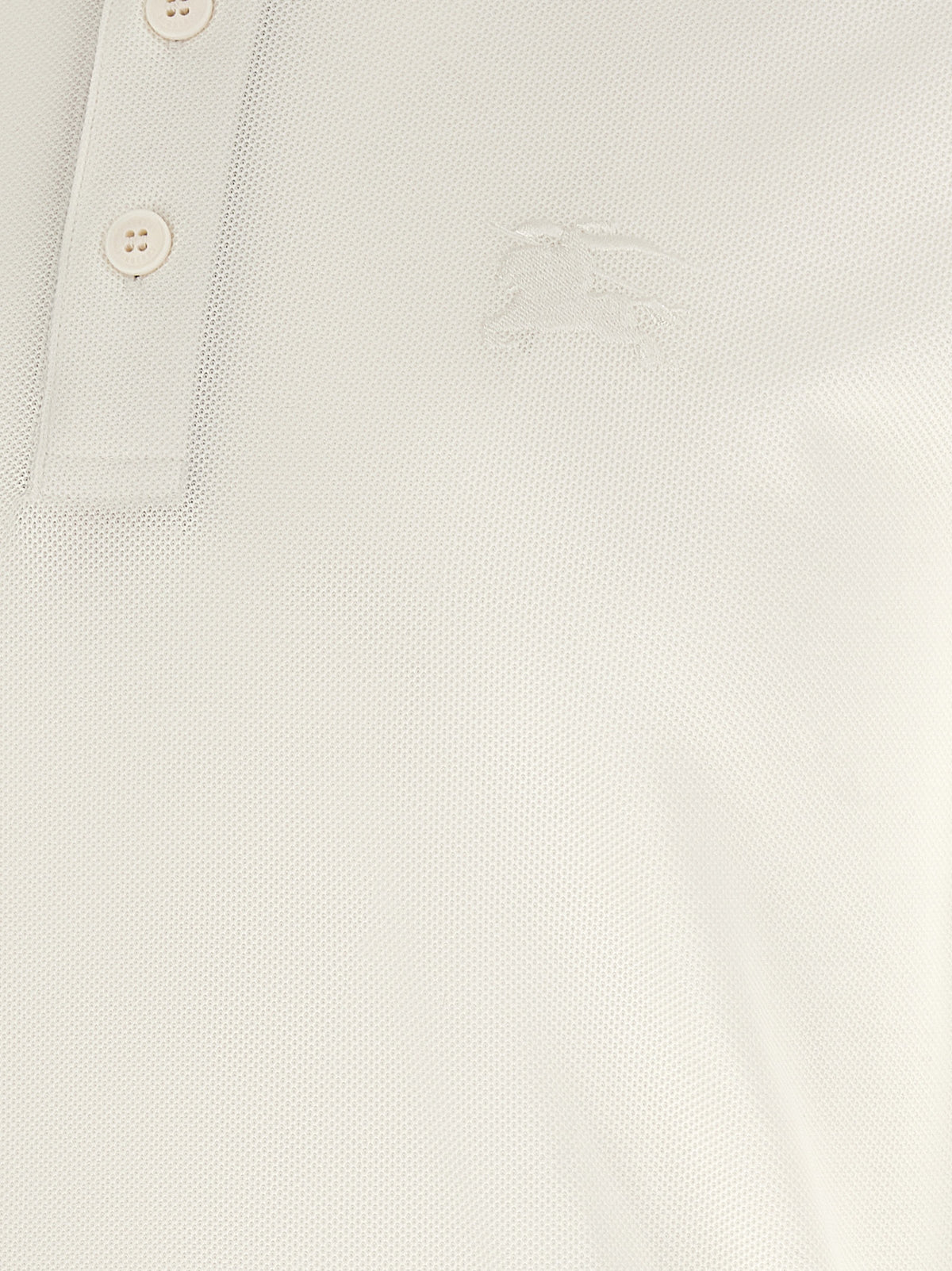 Discover the Burberry White Cotton Polo Shirt, a masterpiece of luxury and craftsmanship, blending timeless elegance with modern sophistication for the discerning individual.