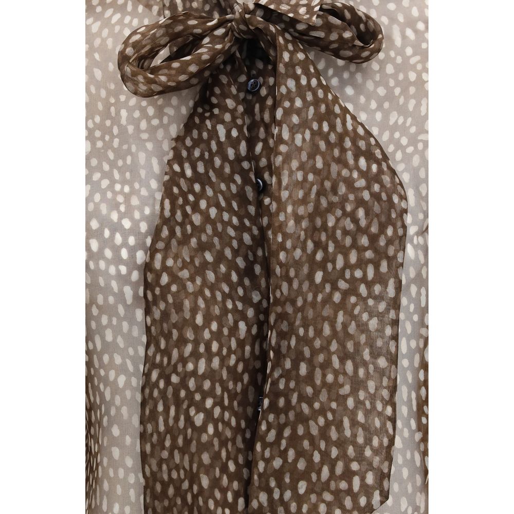 Indulge in the exquisite Brunello Cucinelli Brown Silk Pattern Shirt, a masterpiece of dapple silk organza, embodying refined elegance and timeless allure for the discerning individual.