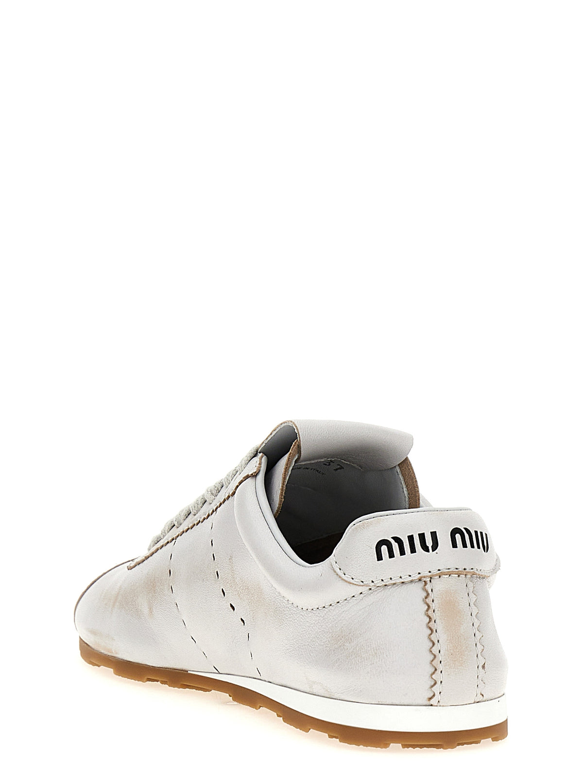 Elevate your style with Miu Miu White Calfskin Low Top Sneakers, where exquisite craftsmanship meets timeless elegance, perfect for the discerning fashionista.