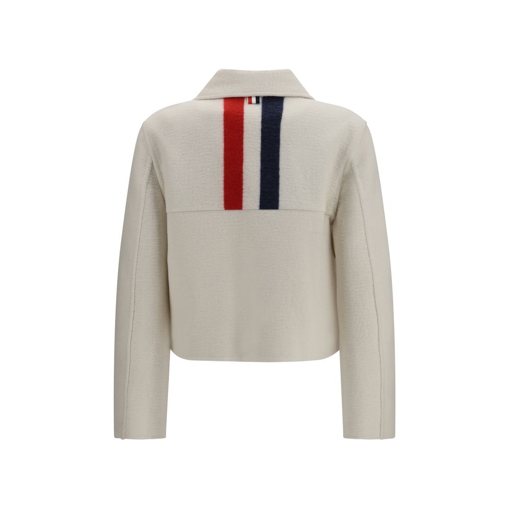 Elevate your elegance with the Thom Browne Beige Wool Oves Aries Jacket, crafted from luxurious Merino wool and Kashmir, embodying refined sophistication for the discerning individual.