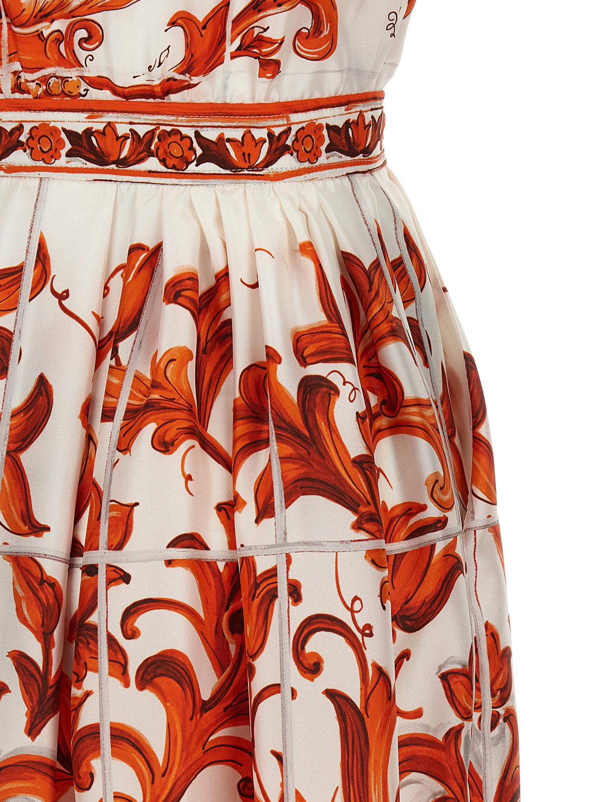 Indulge in the exquisite Dolce & Gabbana Orange Silk Midi Dress, a masterpiece of Italian craftsmanship that embodies timeless elegance and sophisticated allure.