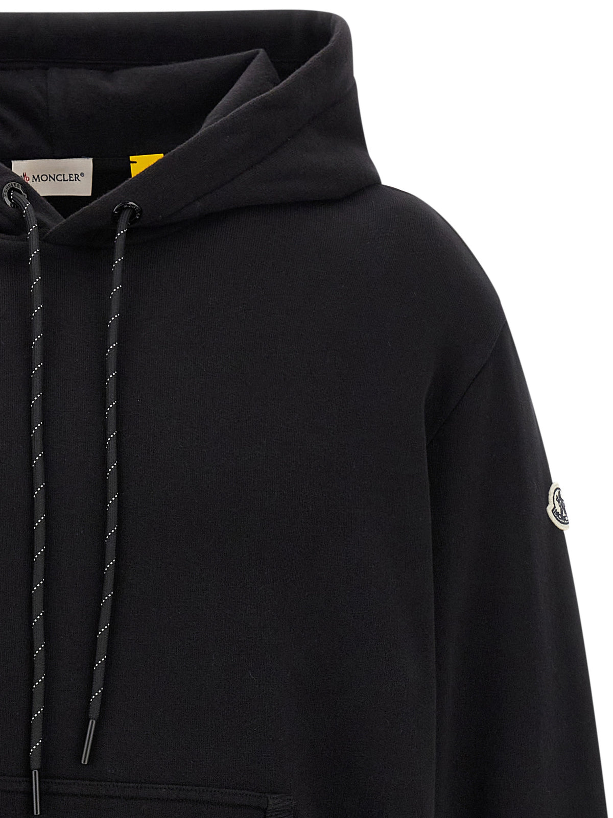 Elevate your wardrobe with the Moncler Genius Black Cotton Sweatshirt, a luxurious blend of comfort and style, perfect for the discerning individual who embraces modern elegance.