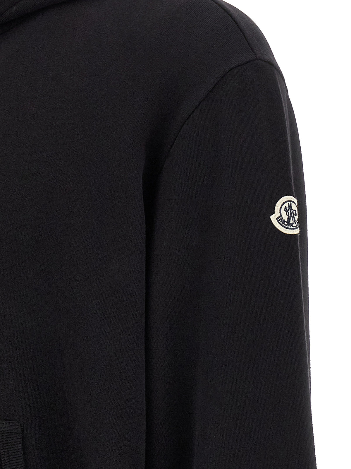 Elevate your wardrobe with the Moncler Genius Black Cotton Sweatshirt, a luxurious blend of comfort and style, perfect for the discerning individual seeking modern elegance.