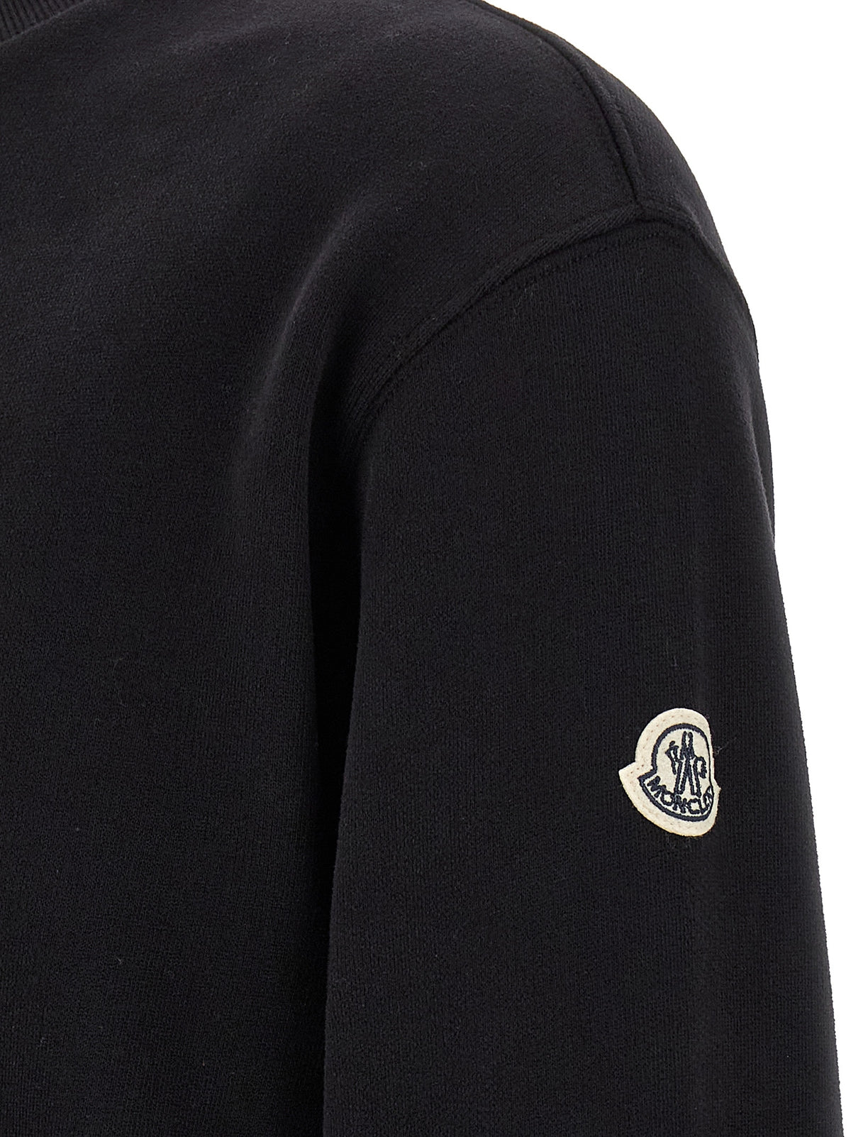 Elevate your wardrobe with the MONCLER GENIUS Black Cotton Sweatshirt, a masterpiece of urban elegance crafted from 100% cotton, embodying sophistication and versatility.