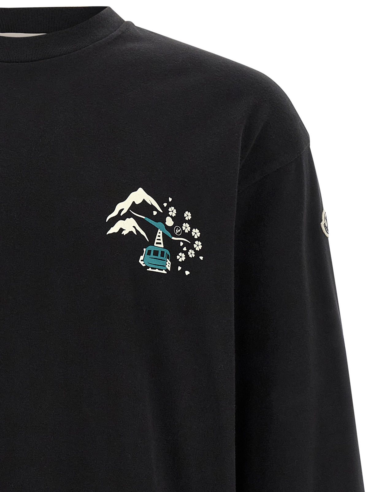 Elevate your wardrobe with the Moncler Genius Black Cotton T-Shirt, crafted from luxurious brushed cotton, embodying sophistication and cultural connection.