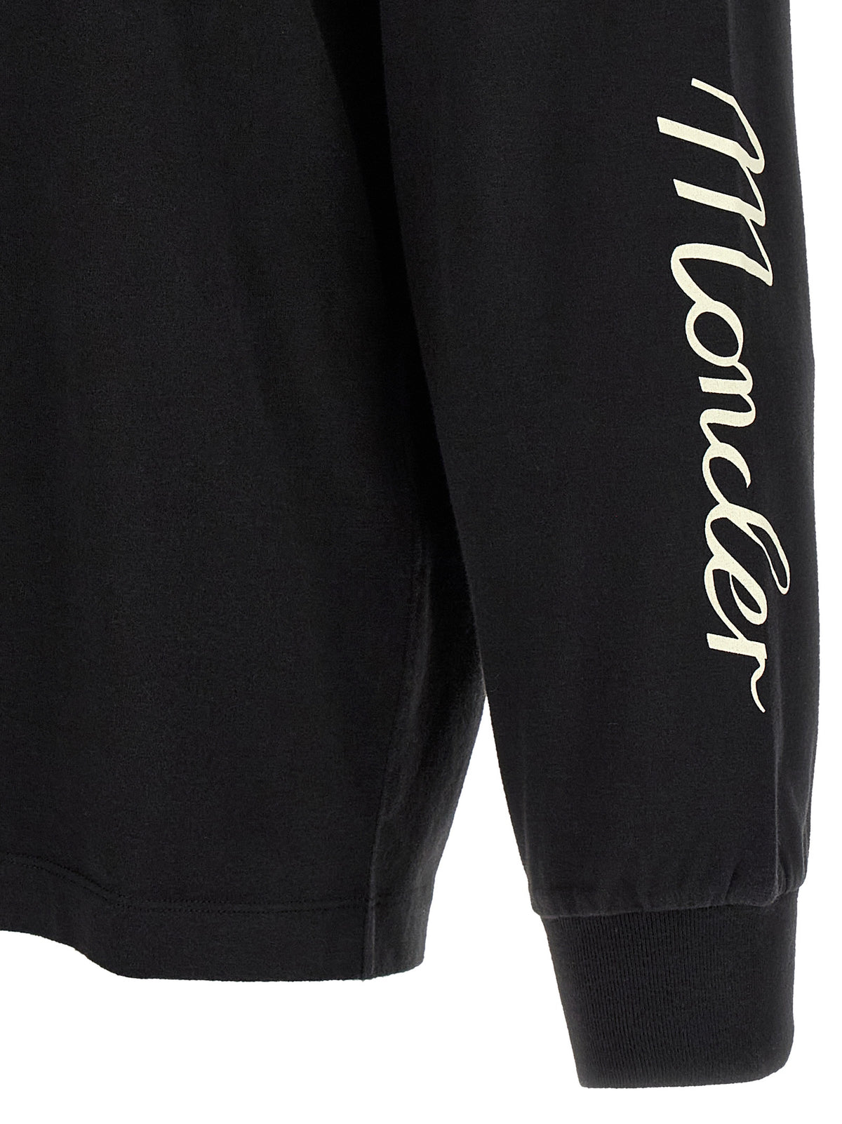 Elevate your wardrobe with the Moncler Genius Black Cotton T-Shirt, a luxurious blend of comfort and style, featuring dynamic graphics that celebrate cultural sophistication.