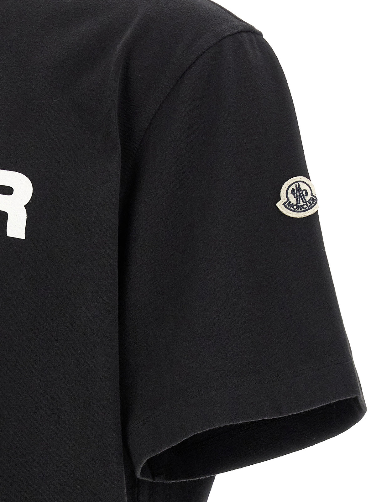 Discover the Moncler Genius Black Cotton T-Shirt, a luxurious blend of artistry and comfort, crafted from soft brushed cotton for the discerning individual.