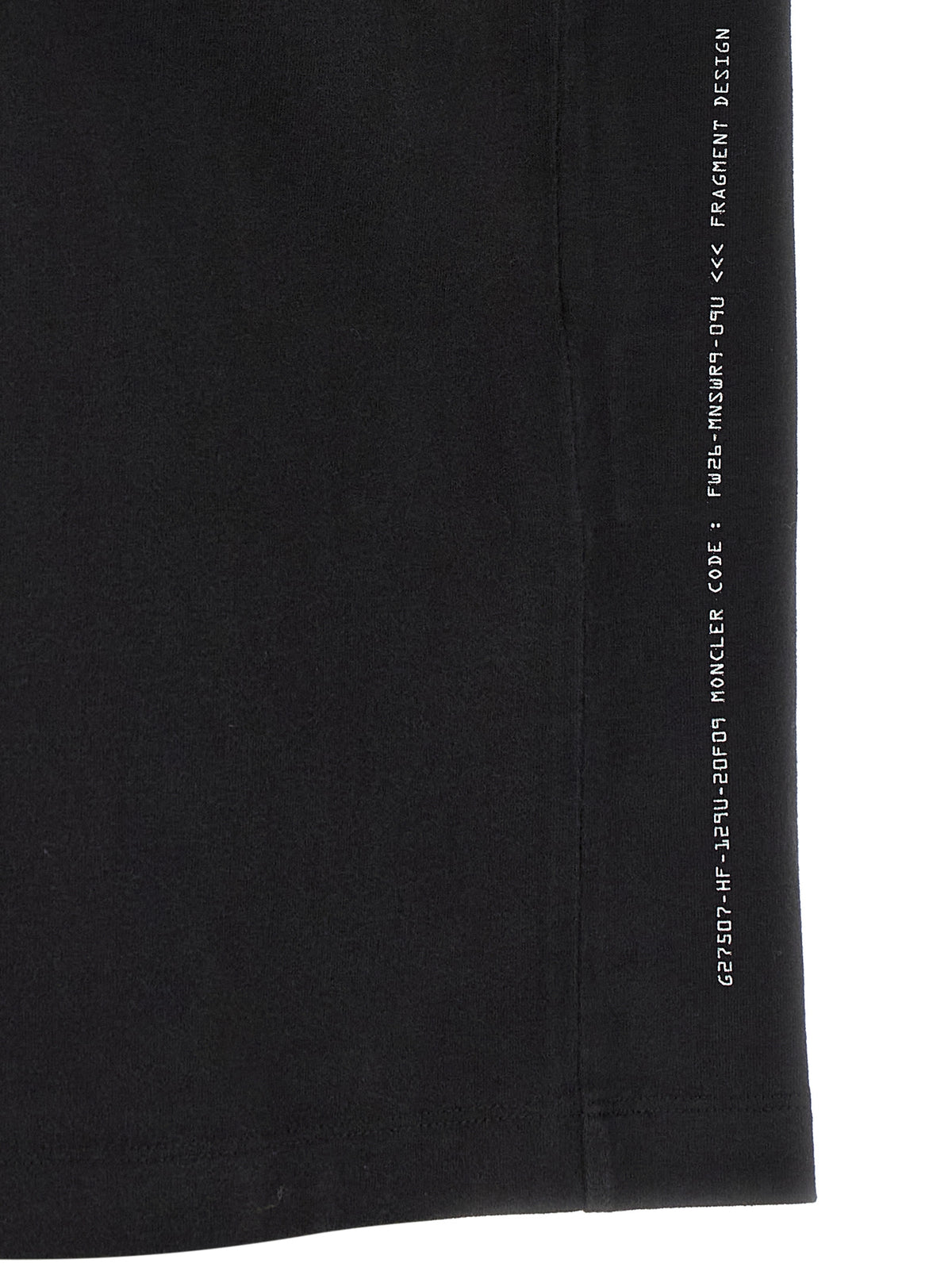 Discover the Moncler Genius Black Cotton T-Shirt, a luxurious blend of soft brushed cotton and avant-garde design, perfect for the discerning modern connoisseur.