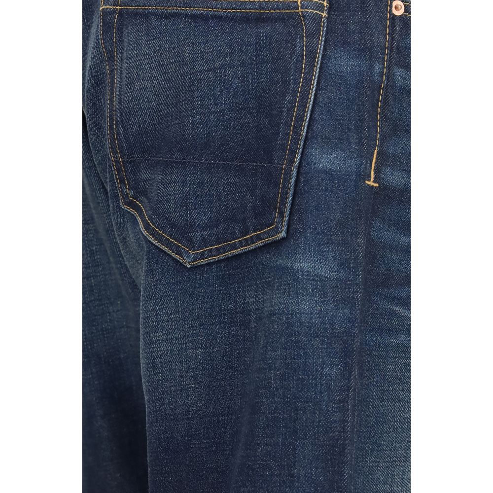 Discover the Tom Ford Blue Cotton Straight-Leg Jeans, a masterpiece of washed selvedge denim that embodies timeless elegance and exceptional craftsmanship for the discerning individual.