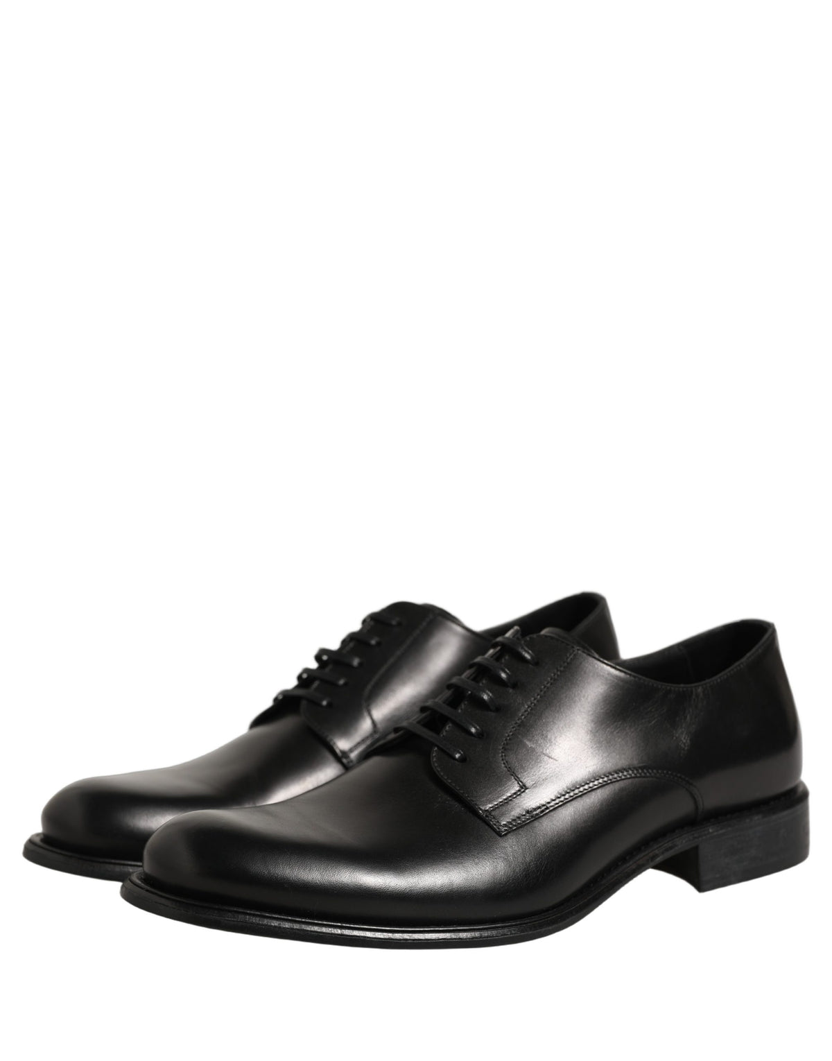 Indulge in the exquisite craftsmanship of Dolce & Gabbana's Black Calfskin Leather Derby shoes, a timeless statement of sophistication for the discerning individual.