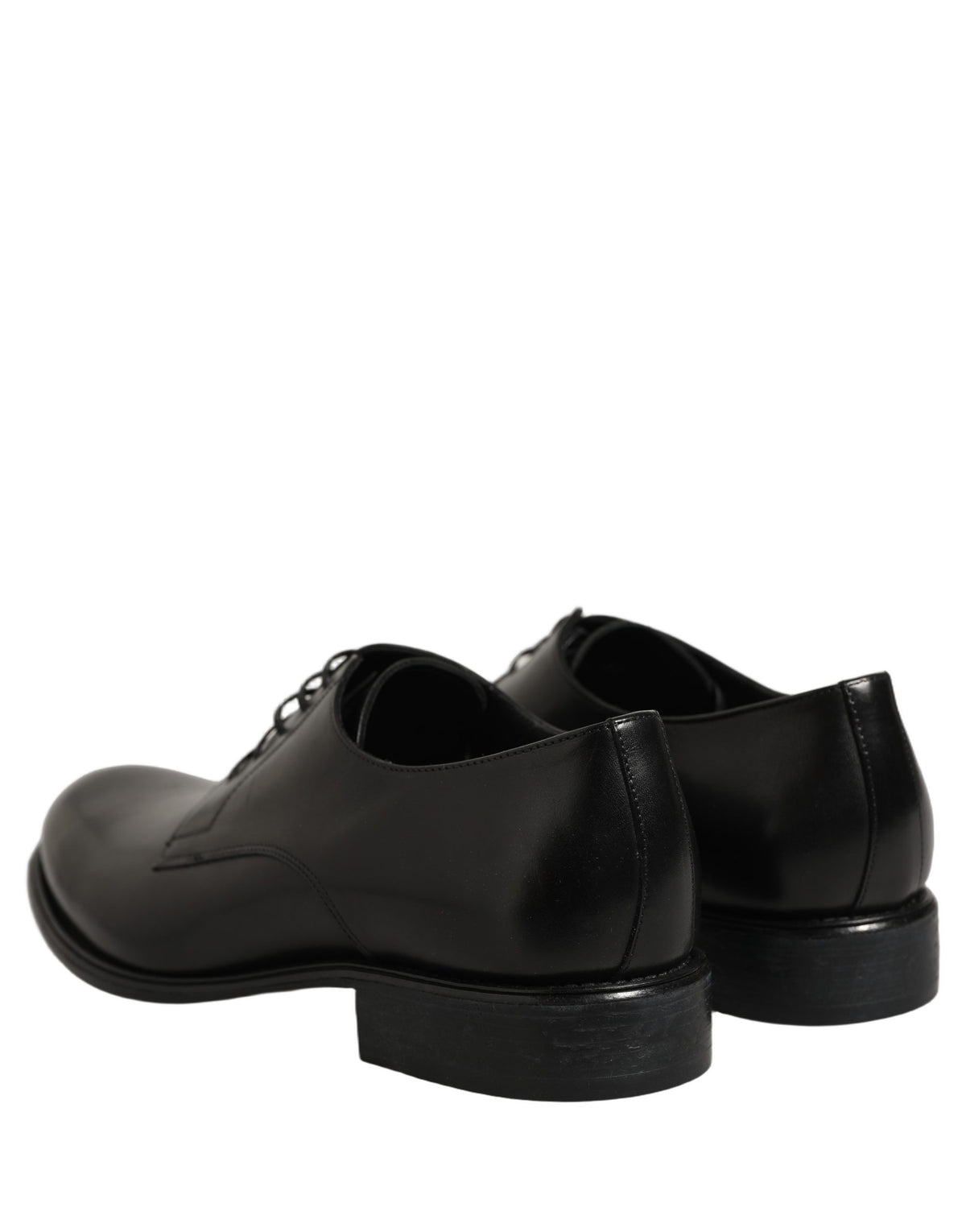 Experience the exquisite allure of Dolce & Gabbana's Black Calfskin Leather Derby Shoes, where unparalleled craftsmanship meets timeless elegance for the discerning individual.