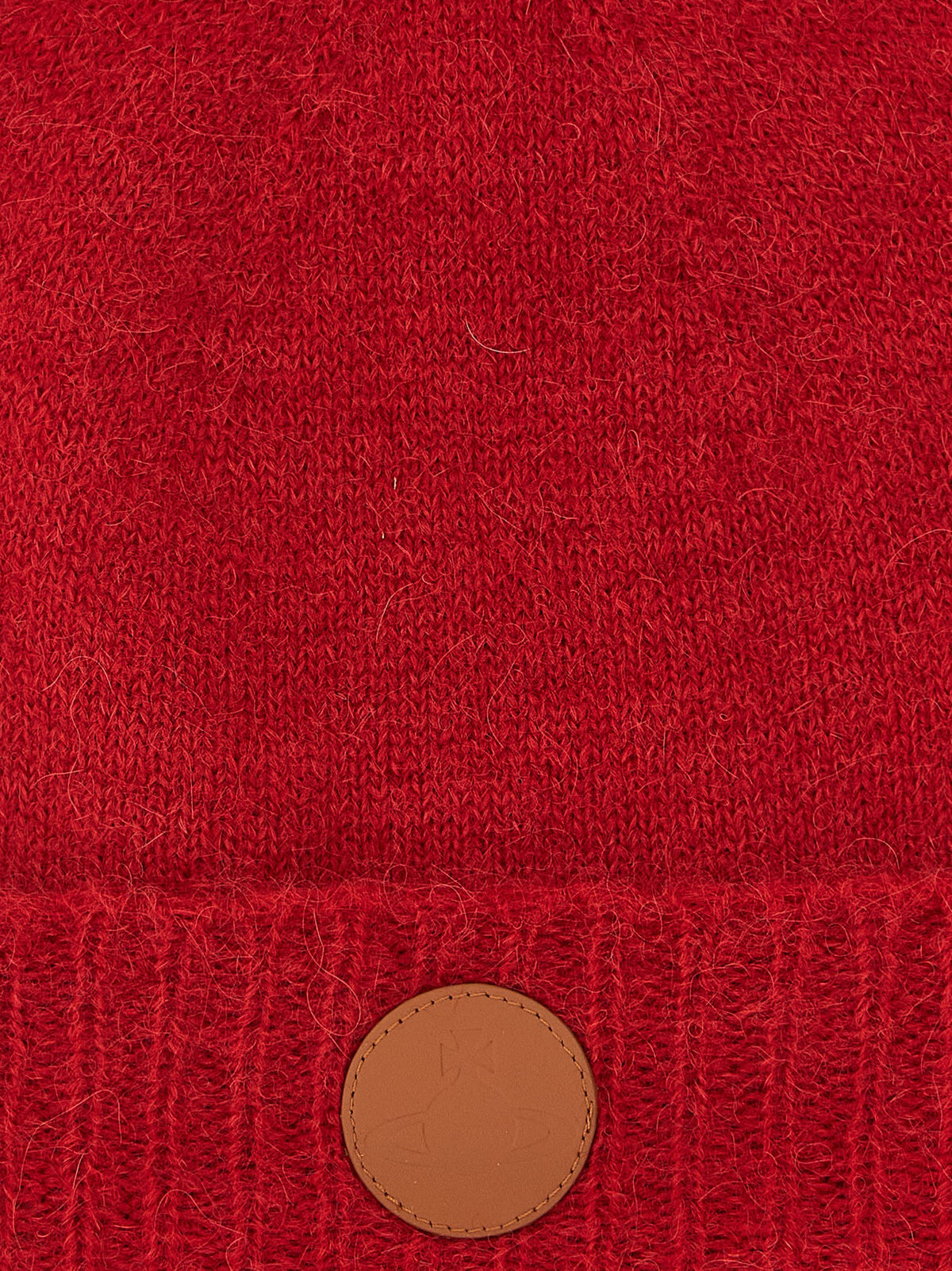 Indulge in the Vivienne Westwood Red Wool Beanie, a luxurious blend of alpaca wool and mohair, crafted in Italy for those who embrace elegance and warmth.