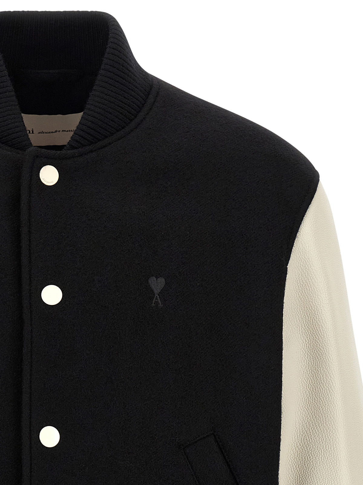 Elevate your style with the AMI PARIS Bicolor Virgin Wool Bomber, a luxurious blend of black boiled wool and cream leather, embodying timeless sophistication and bold elegance.