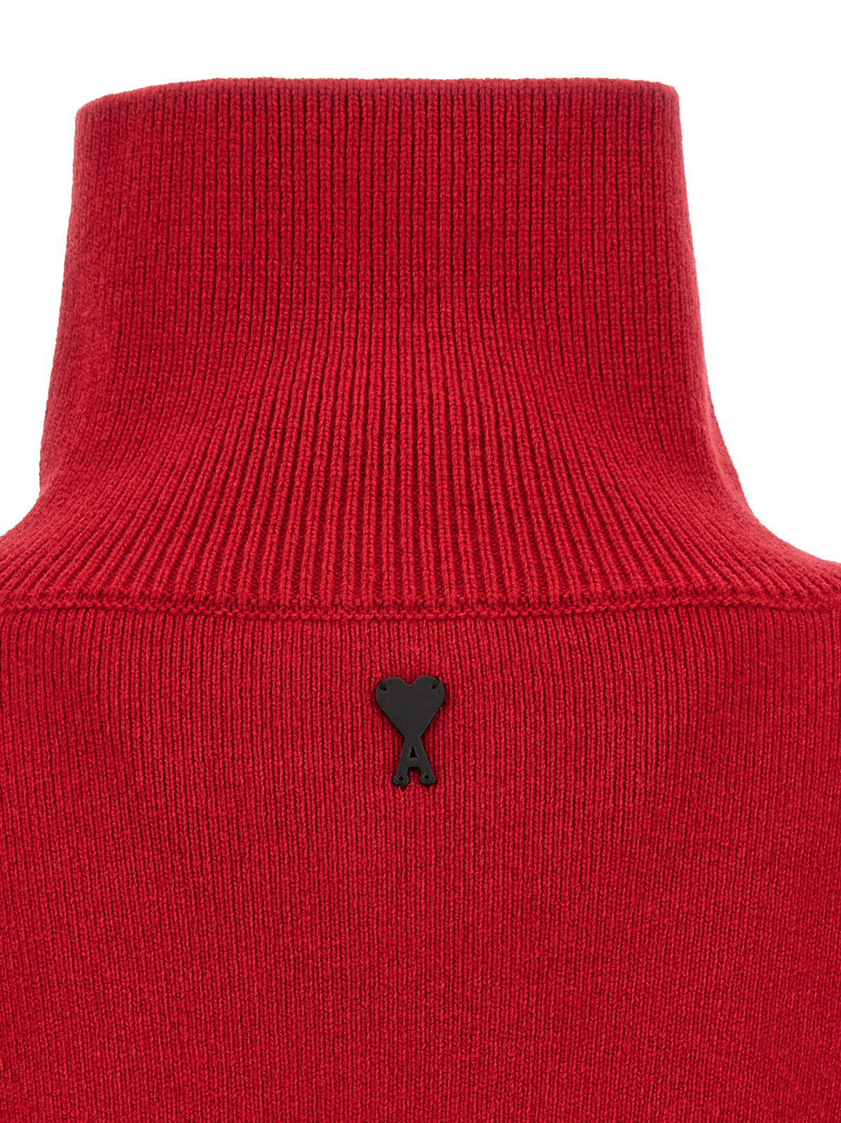 Indulge in the sophistication of the Ami Paris Red Wool Cardigan, a masterpiece of pure wool craftsmanship that elevates your wardrobe with Parisian elegance and timeless style.