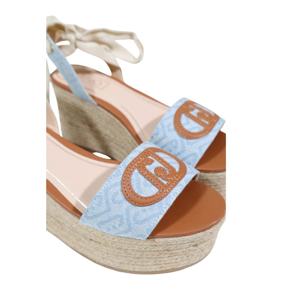 Elevate your summer style with Liu Jo's Light Blue Polyester Wedge Sandals, featuring a woven rope wedge and elegant bow closure for a sophisticated touch.