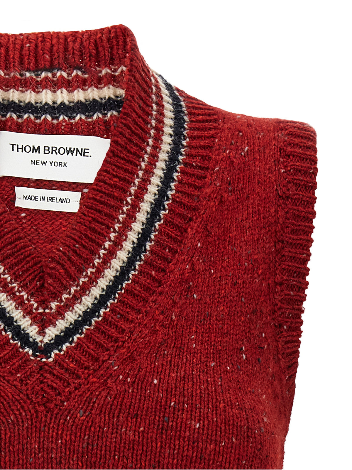 Elevate your wardrobe with the Thom Browne Red Wool Sleeveless Jacket, a luxurious blend of wool and mohair, embodying timeless elegance and sophisticated artistry.