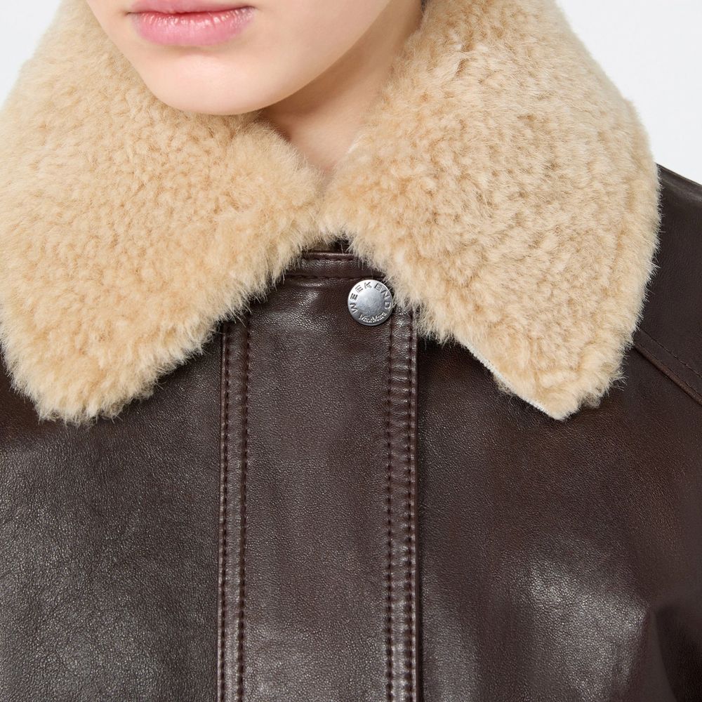Indulge in the exquisite Max Mara Brown Lamb Leather Bomber, a masterpiece of craftsmanship and luxury, designed for those who embody elegance and sophistication.