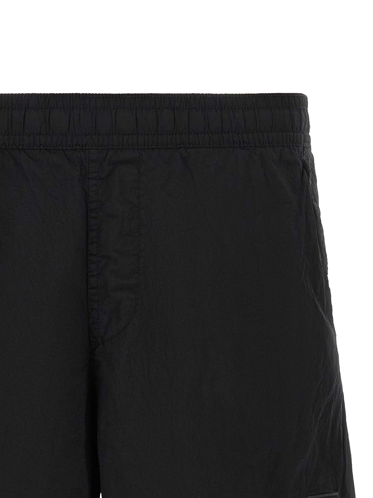 Elevate your summer wardrobe with Stone Island Black Polyamide Cargo Shorts, crafted from sustainable ECONYL nylon, merging luxury with functionality for the discerning individual.