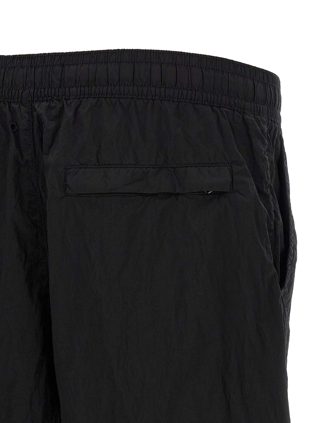 Elevate your summer wardrobe with Stone Island Black Polyamide Cargo Shorts, crafted from sustainable ECONYL nylon for a luxurious blend of style and function.