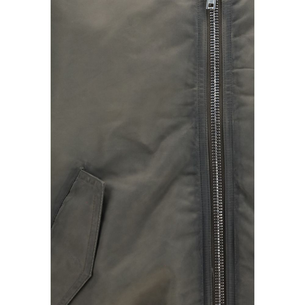 Elevate your wardrobe with the Rick Owens Gray Nylon Bomber, a luxurious statement piece crafted from exquisite medium-weight satin, embodying sophistication and style.