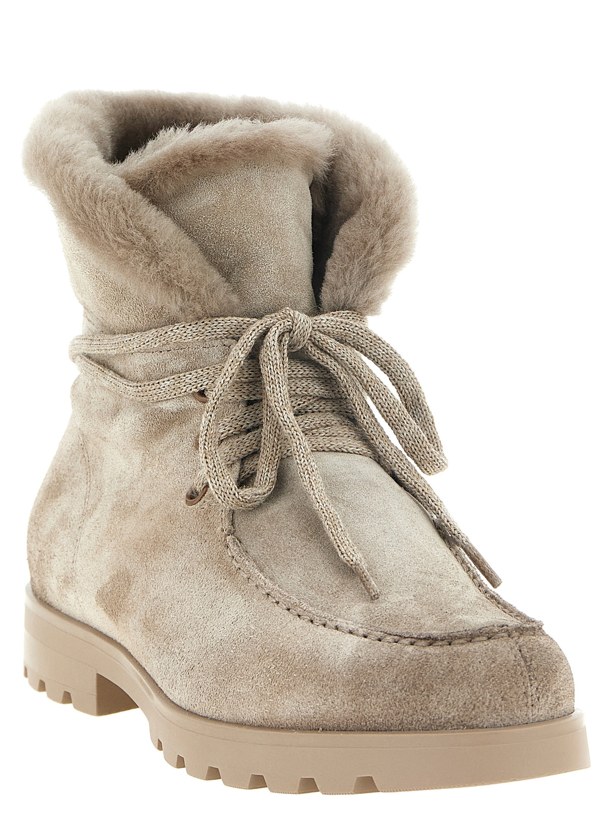 Experience the allure of Santoni Beige Calfskin Ankle Boots, where exquisite suede meets luxurious shearling, embodying refined Italian artistry for the discerning individual.