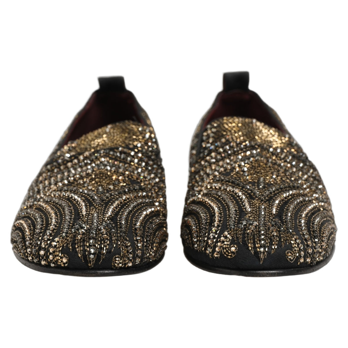 Indulge in the exquisite allure of Dolce & Gabbana's Black Gold Embellished Slippers, where Italian craftsmanship meets opulent design, perfect for those who embody elegance and sophistication.