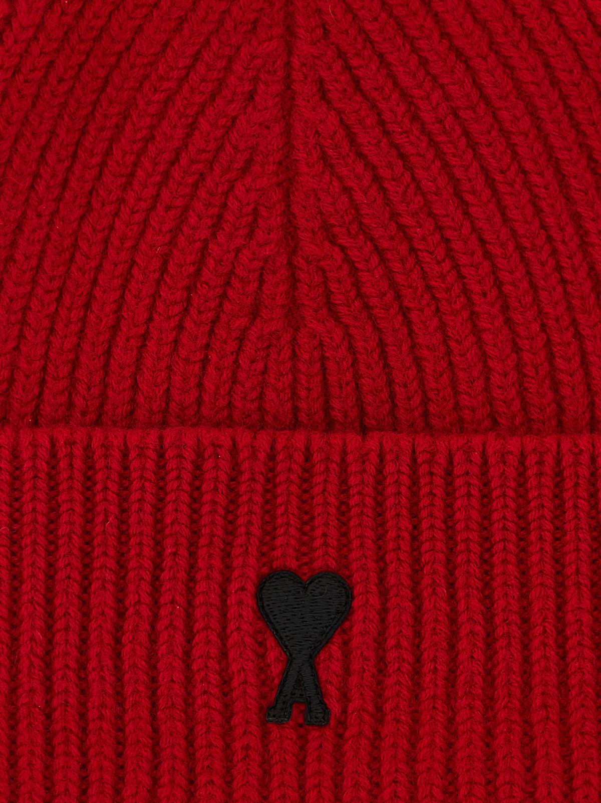 Elevate your winter wardrobe with the Ami Paris Red Wool Beanie, a masterpiece of Italian craftsmanship that embodies timeless elegance and comfort.