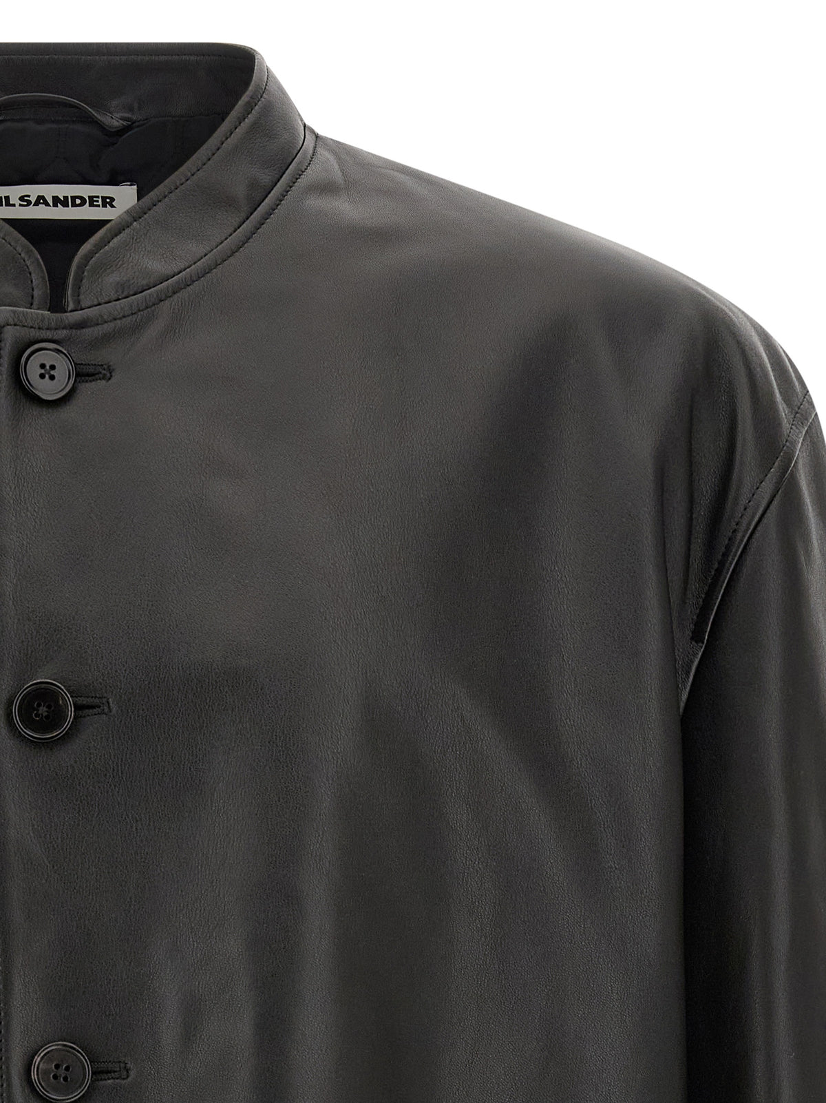 Discover the Jil Sander Black Calfskin Leather Jacket, a masterpiece of Italian craftsmanship, where timeless elegance meets luxurious sophistication for the discerning individual.