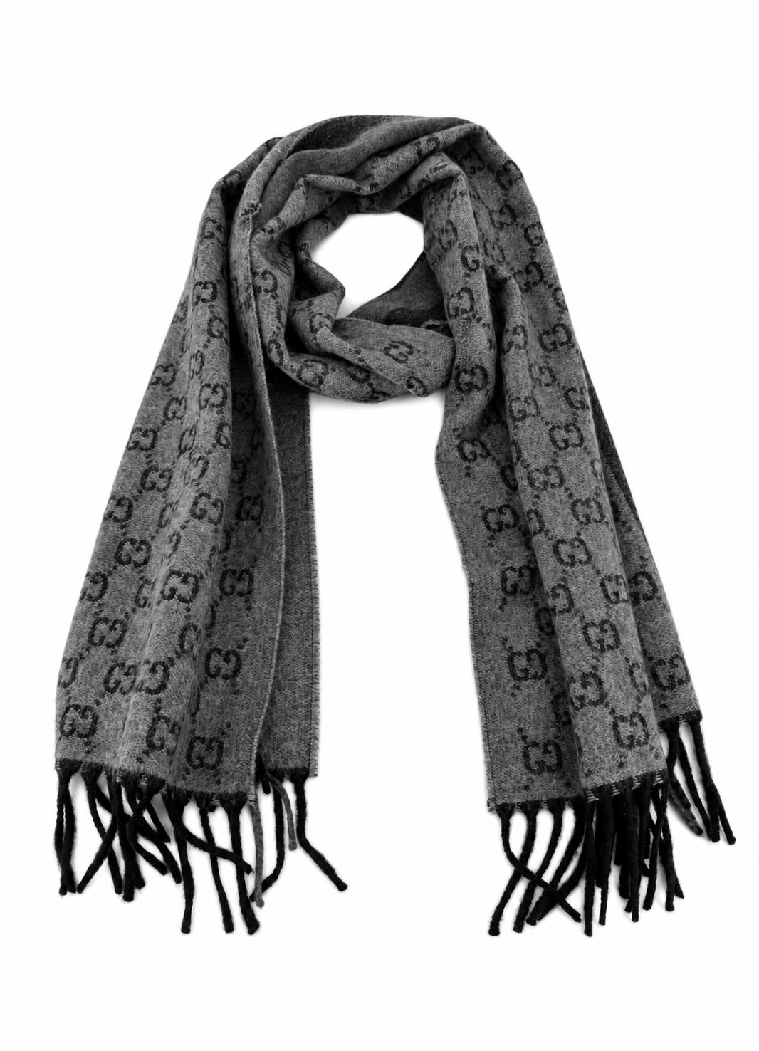 Indulge in the elegance of the Gucci Monogram Grey Wool Scarf, a luxurious blend of cashmere and wool, perfect for sophisticated autumn styling.